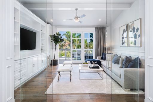 A modern living room with white furniture in a new construction home in Encino, California