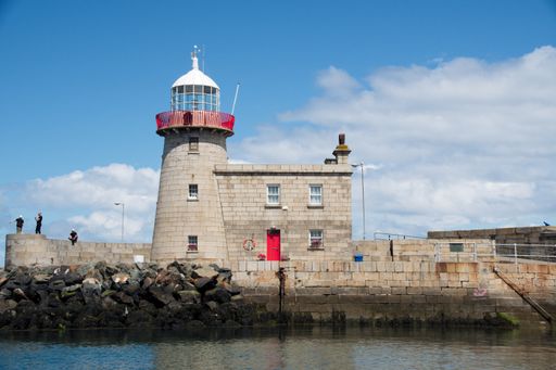 A lighthouse on a rocky island in Dublin, Ireland