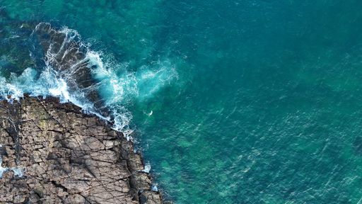 An aerial view of beautiful reef break waves