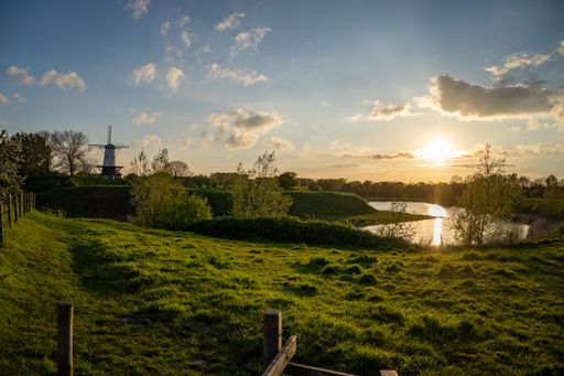 A view of a windmill at sundown at the small village Veere in Zeeland the Netherlands