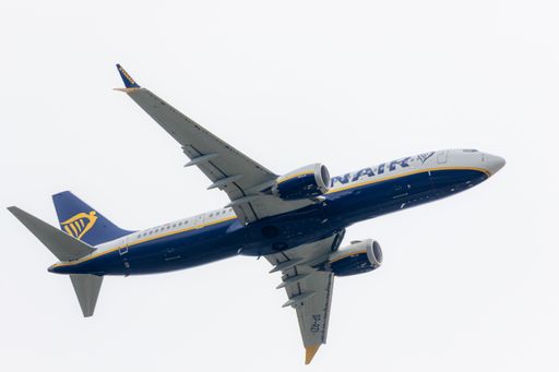 Airborne Ryanair plane featuring logo in flight