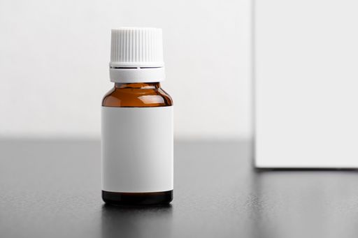 A child dietary supplement brown glass bottle with blank white label - editable mockup template