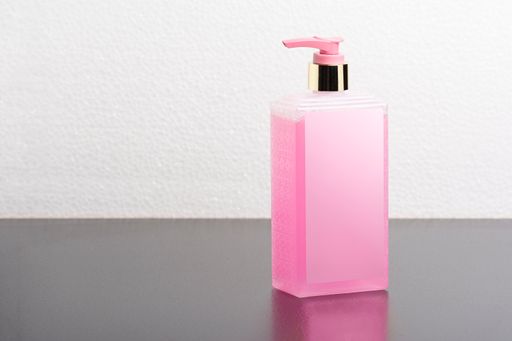 A pink body shampoo bottle with blank packaging - editable mockup template