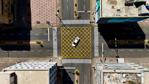 Aerial view of a city street intersection with multiple roads