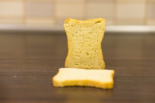 A closeup of toasted bread slices on the wooden table