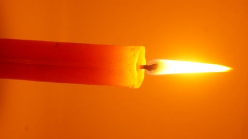 A shot of a burning candle