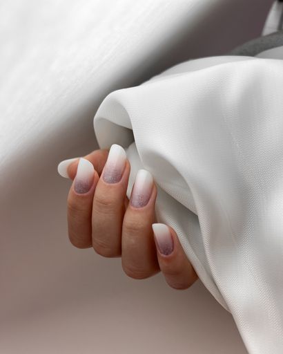 The Gel manicure on a Caucasian Woman Hand