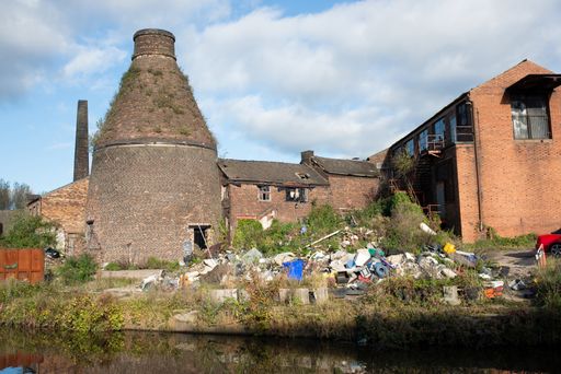 Former pottery with bottle kiln and pile of garbage, Stoke-on-Trent