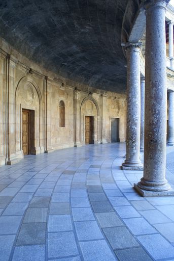 A vertical of the columns and rooms of the Palace of Charles V in Granada, Spain