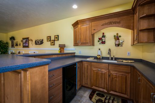 An old style kitchen with wooden furniture