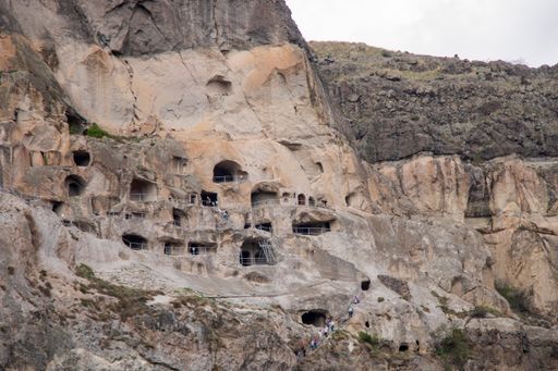 A scenic view of Vardzia caves nestled in a cliffside