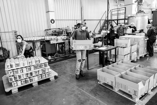 A group of workers on assembly line in glue factory, Johannesburg, South Africa