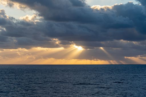 A stunning sunset over the ocean viewed from a cruise ship in the Atlantic
