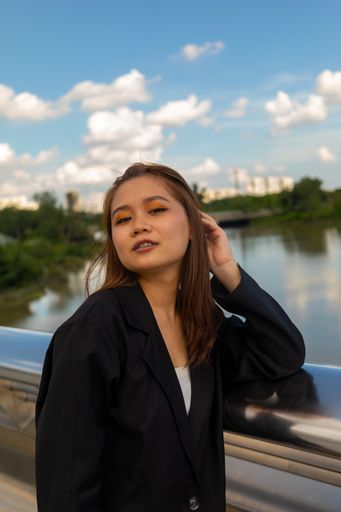 A beautiful lady from Vietnam posing at Starlight bridge on a windy day, Ho Chi Minh City, Vietnam