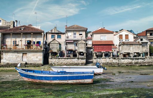 Two fisherman boats beached at low tide in the Galician town of Combarro, Spain.