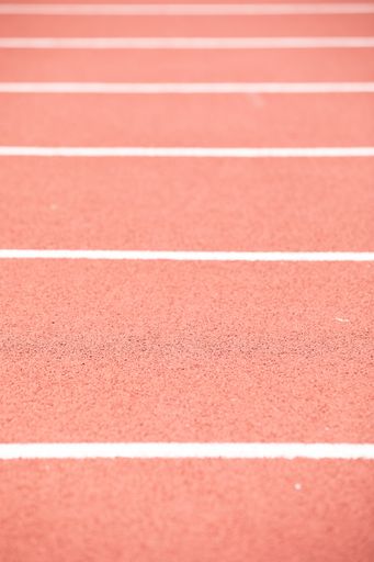 A vertical shot of a track with red and white markings and stripes