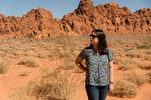 A beautiful shot of a Caucasian female posing in the Valley of Fire during the day