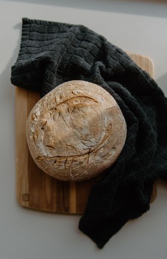 Loaf of bread on cutting board