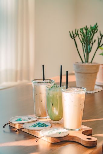 A vertical shot of fresh smoothies on the kitchen table