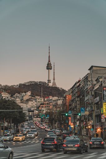 A vertical shot of street against the Namsan Tower in Seoul, Korea