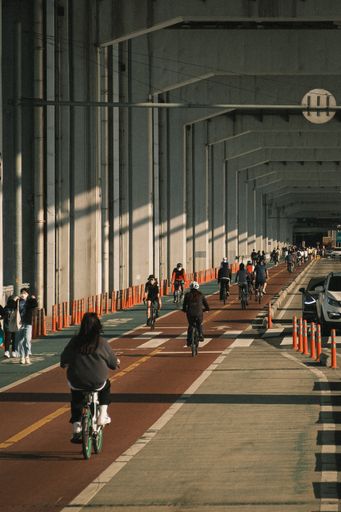 A group of people riding bicycles on bicycle lanes in Korea