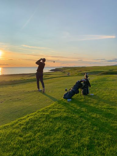 An Evening golf in Iceland with golf bags