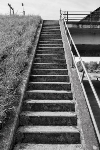Concrete steps leading to the roof of a building in a straight line