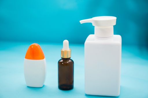 A bunch of healthcare products for bath on the blue decorative background