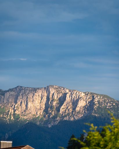 An aerial shot of a steep mountain during a cloudy day
