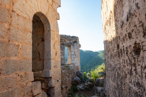 A scenic view of historical ruins on a blue sky background