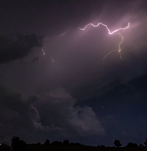Lightning strikes across the night sky