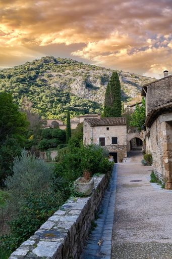 Saint-Guilhem-le-Desert in France, view of the village, typical street and houses