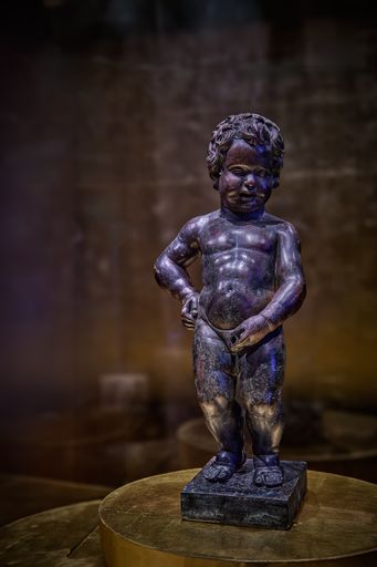 A room with a statue placed on a table