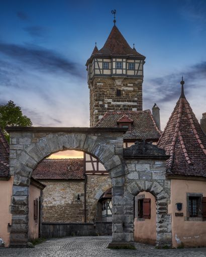 The stone gate and Roder Tower in Rothenburg ob der Tauber. Bavaria, Germany