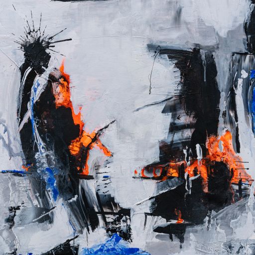 A vertical closeup of the combination of colors mixed together. Black, blue, white, orange.