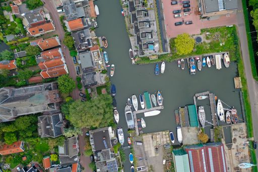 topdown shot of canal near church Meerpad in Amsterdam city