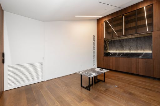Minimalist room with wooden paneling and flooring