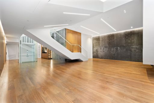 Spacious room with central staircase