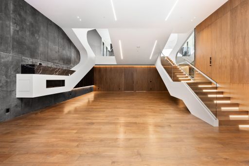 Staircase flanked by tables on both sides