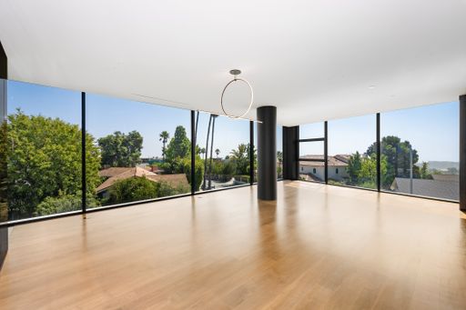 Bright wooden floor with multiple windows embedded