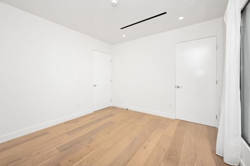 An empty room with white walls and a wooden floor. Home interior. California, USA