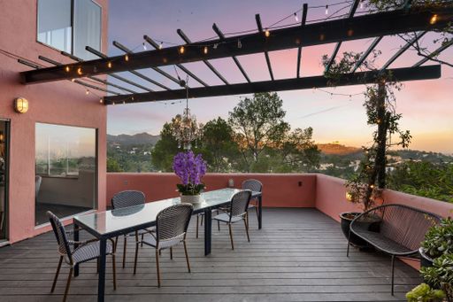 A terrace with a view of the city skyline at sunset. California, USA