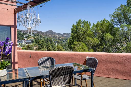 A terrace with a view of green hills and blue sky. Los Angeles, California, USA