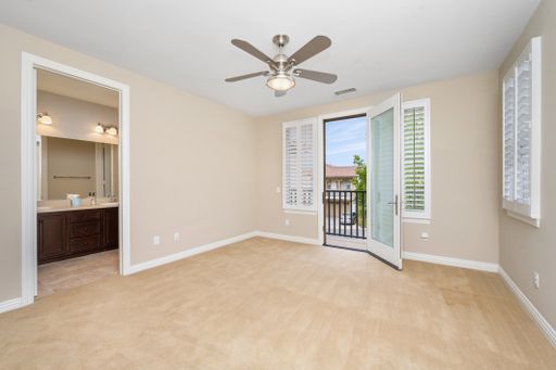 A room featuring windows with white blinds and a ceiling fan. California, USA
