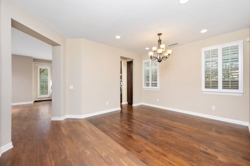 A living room with wooden floors and an elegant chandelier. California, USA