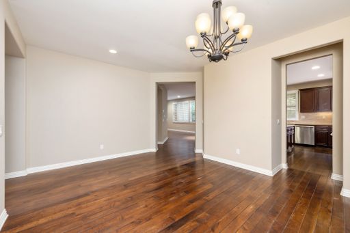 An empty room with wooden floors and a chandelier. California, USA