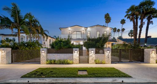 A house with a beautiful garden and metal gates. California, USA