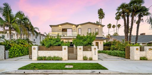 A house with a beautiful garden and metal gates. California, USA