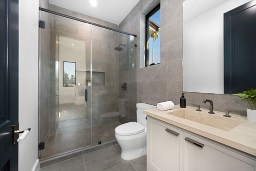 A modern bathroom with gray marble tiles