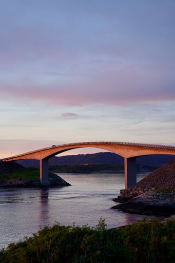 The light of dawn caress the Storseisund bridge on the Atlantic Ocean Road between Kristiansund and Molde, Norway